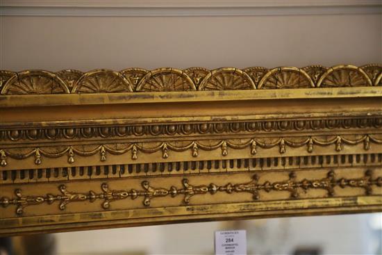 A late Victorian gilt gesso overmantel mirror, W.4ft 8in. H.5ft 3in.